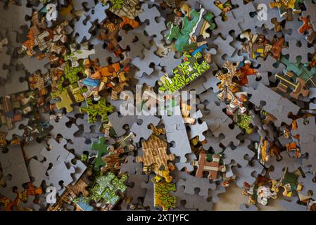 A box full of jigsaw pieces Stock Photo