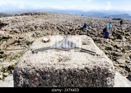 Summit marker at the top of Ben Nevis - highest mountain in the UK, Highlands, Scotland UK Stock Photo