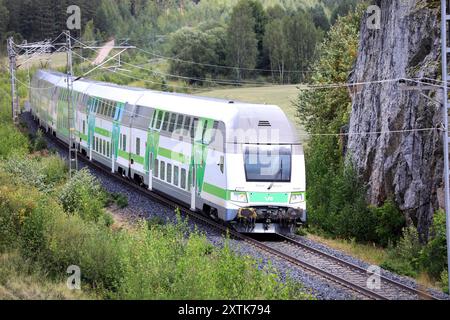 Modern VR Group Intercity electric 2 storey passenger train on the move after departing Salo on a day of summer. Salo, Finland. August 10, 2024. Stock Photo