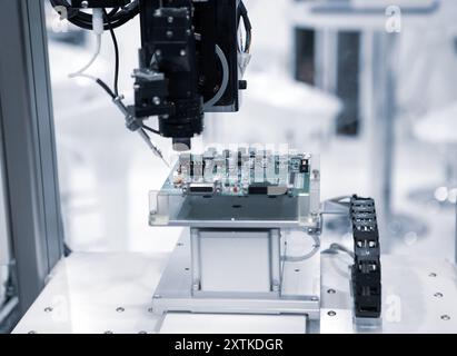Production of automated robot for print circuit board (PCB) assembly for spot soldering of printed circuit boards. Stock Photo