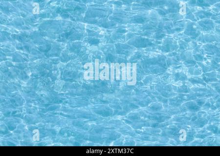 Water H2O - aerial view of large region of clean, clear, blue water ripples. Image is seamless texture pattern to create a high resolution background. Stock Photo