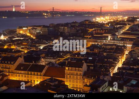 View across the city and the 25 de Abril bridge crossing the Tagus river in Lisbon in Portugal in Europe Stock Photo