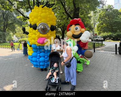 August 15, 2024, New York City, New York: (NEW) Balloon Story at Central Park. August 15, 2024, New York, USA: Balloon Story displaying characters like Mario, Yoshi and Mania at Central Park, on their way to the Balloon Story exhibition at Armory on 66 and Park; attracting curious people especially kids who got involved in a dance show with them.Credit: Niyi Fote/Thenews2 (Foto: Niyi Fote/Thenews2/Zumapress) (Credit Image: © Niyi Fote/TheNEWS2 via ZUMA Press Wire) EDITORIAL USAGE ONLY! Not for Commercial USAGE! Stock Photo