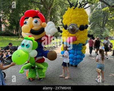 August 15, 2024, New York City, New York: (NEW) Balloon Story at Central Park. August 15, 2024, New York, USA: Balloon Story displaying characters like Mario, Yoshi and Mania at Central Park, on their way to the Balloon Story exhibition at Armory on 66 and Park; attracting curious people especially kids who got involved in a dance show with them.Credit: Niyi Fote/Thenews2 (Foto: Niyi Fote/Thenews2/Zumapress) (Credit Image: © Niyi Fote/TheNEWS2 via ZUMA Press Wire) EDITORIAL USAGE ONLY! Not for Commercial USAGE! Stock Photo