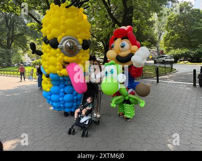 August 15, 2024, New York City, New York: (NEW) Balloon Story at Central Park. August 15, 2024, New York, USA: Balloon Story displaying characters like Mario, Yoshi and Mania at Central Park, on their way to the Balloon Story exhibition at Armory on 66 and Park; attracting curious people especially kids who got involved in a dance show with them.Credit: Niyi Fote/Thenews2 (Foto: Niyi Fote/Thenews2/Zumapress) (Credit Image: © Niyi Fote/TheNEWS2 via ZUMA Press Wire) EDITORIAL USAGE ONLY! Not for Commercial USAGE! Stock Photo