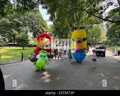 August 15, 2024, New York City, New York: (NEW) Balloon Story at Central Park. August 15, 2024, New York, USA: Balloon Story displaying characters like Mario, Yoshi and Mania at Central Park, on their way to the Balloon Story exhibition at Armory on 66 and Park; attracting curious people especially kids who got involved in a dance show with them.Credit: Niyi Fote/Thenews2 (Foto: Niyi Fote/Thenews2/Zumapress) (Credit Image: © Niyi Fote/TheNEWS2 via ZUMA Press Wire) EDITORIAL USAGE ONLY! Not for Commercial USAGE! Stock Photo