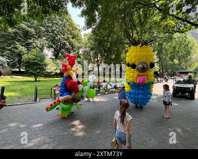 August 15, 2024, New York City, New York: (NEW) Balloon Story at Central Park. August 15, 2024, New York, USA: Balloon Story displaying characters like Mario, Yoshi and Mania at Central Park, on their way to the Balloon Story exhibition at Armory on 66 and Park; attracting curious people especially kids who got involved in a dance show with them.Credit: Niyi Fote/Thenews2 (Foto: Niyi Fote/Thenews2/Zumapress) (Credit Image: © Niyi Fote/TheNEWS2 via ZUMA Press Wire) EDITORIAL USAGE ONLY! Not for Commercial USAGE! Stock Photo