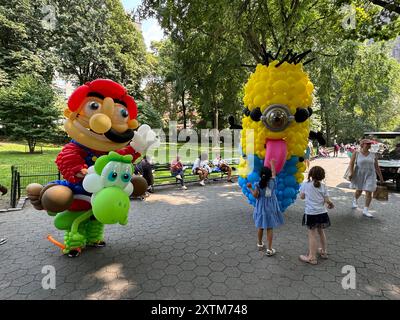 August 15, 2024, New York City, New York: (NEW) Balloon Story at Central Park. August 15, 2024, New York, USA: Balloon Story displaying characters like Mario, Yoshi and Mania at Central Park, on their way to the Balloon Story exhibition at Armory on 66 and Park; attracting curious people especially kids who got involved in a dance show with them.Credit: Niyi Fote/Thenews2 (Foto: Niyi Fote/Thenews2/Zumapress) (Credit Image: © Niyi Fote/TheNEWS2 via ZUMA Press Wire) EDITORIAL USAGE ONLY! Not for Commercial USAGE! Stock Photo