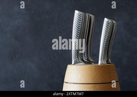 Casting steel various chef knife, Set of modern sharp kitchen knives on dark background Stock Photo