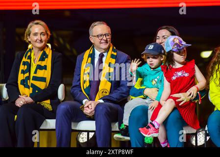 (L-R) CEO of Qantas Vanessa Hudson, Prime Minister of Australia Anthony Albanese, and 2024 Australian Olympic Team Chef de mission Anna Meares with her children are seen during the Welcome Home event for Australian Olympic Team returning from Paris. Official Australian Olympic Team arrival 'Welcome home' party at Qantas Hangar 96, as Australian Olympians disembark Qantas 'Go Aussies' Dreamliner jet in Sydney Airport. The team, wearing 'green and gold', was greeted by Australian government officials, sports officials, Qantas staff, media and family members. (Photo by Alexander Bogatyrev/SOPA Stock Photo