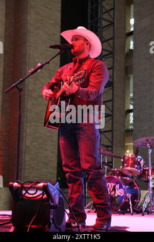 DALLAS, TX, USA - AUGUST 15, 2024. Wynn Williams performs at the Neon Cowboy Party, for the August WESA Trade Show and Dallas Market. Stock Photo