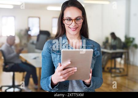 Tablet, smile and woman in office, online and glasses for reading of website, research and business. Happy, vision and web designer on app for coding Stock Photo