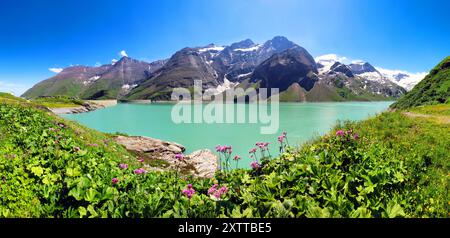 Panorama of a beautiful alpine summer view with reflections in a lake Mooserboden  at the famous Hohe Tauern, Austria Stock Photo