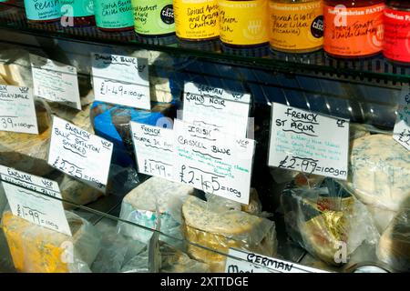 handwritten labels on artisanal cheese varieties on stall display in grainger market newcastle upon tyne city centre uk Stock Photo