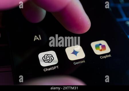 Most popular AI chatbots assistants language models on smartphone screen. ChatGPT, Gemini and Copilot Stock Photo