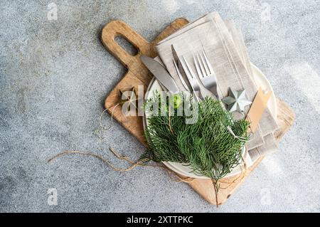 Christmas table setting with fresh thujia Stock Photo
