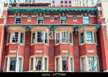 Toronto, Canada - August 14, 2024: Colonial architecture in the National Club building. Located at 303 Bay St., the structure is a famous place. Stock Photo