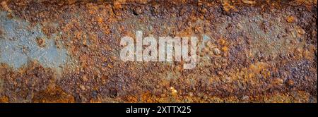 old sheet steel with peeling paint and brown rust Stock Photo