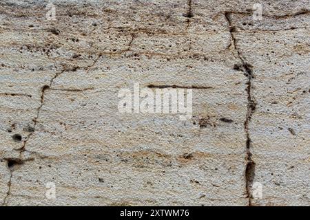 Closeup of old cracked pastel coloured marble wall tile for use as a background texture Stock Photo