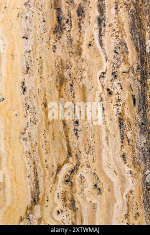 Closeup of old cream coloured marble wall tile for use as a background texture Stock Photo