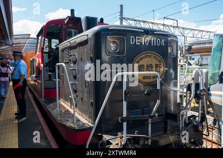 Kyoto Prefecture, Japan - August 11 2024 : Sagano Scenic Railway train stops at the station platform. Stock Photo