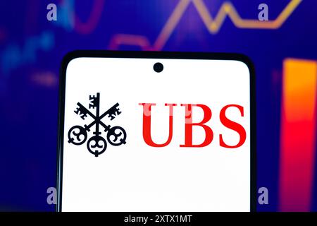 In this photo illustration, the UBS Group AG logo is displayed on a smartphone screen. Stock Photo