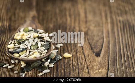 Portion of mixed Seeds (close-up shot, selective focus) on wooden background Stock Photo