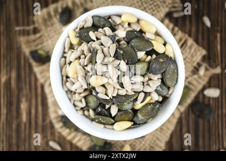 Old wooden table with mixed Seeds (close-up shot, selective focus) Stock Photo