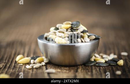 Mixed Seeds (close-up shot, selective focus) on vintage wooden background Stock Photo