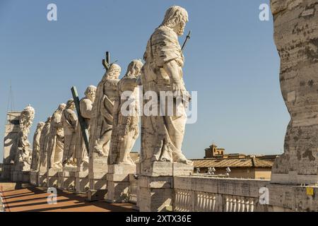 Back view of statues of the saints apostles located on the top of Saint Peter Basilica roof Stock Photo