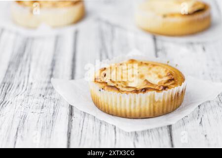 Fresh made Mini Cheesecake on a vintage background (close-up shot) Stock Photo