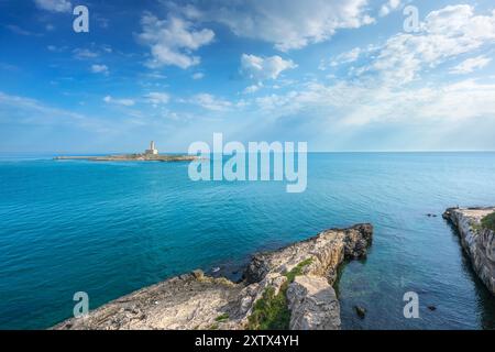 Vieste, rocks and the lighthouse island, Gargano peninsula, Puglia or Apulia region, Italy, Europe. Stock Photo