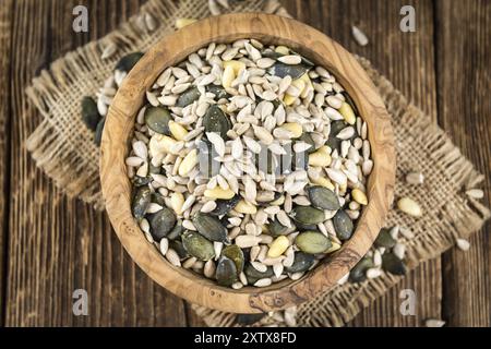 Old wooden table with mixed Seeds (close-up shot, selective focus) Stock Photo