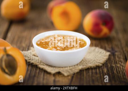 Apricot Jam on an old wooden table as detailed close-up shot (selective focus) Stock Photo