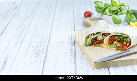 Chicken Wraps on a wooden table as detailed close-up shot (selective focus) Stock Photo