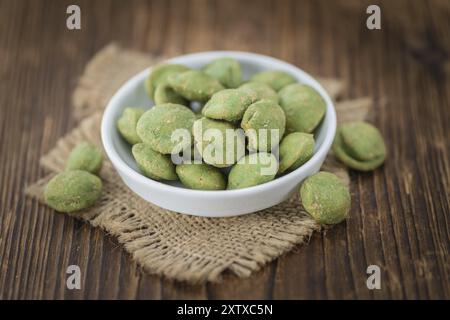 Wasabi Peanuts on a vintage background as detailed close-up shot (selective focus) Stock Photo