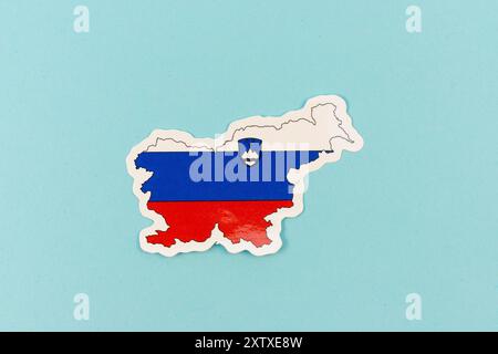 Slovenia Map with Flag Colors on Light Blue Background Stock Photo