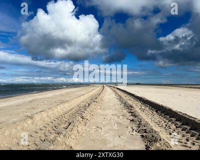 Sandormen tractor tire tracks on the sand on the cape Grenen beach in Skagen, Denmark. Stock Photo