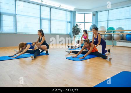 Effective paired stretching exercises in a health group Stock Photo