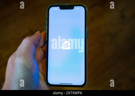 USA. 12th July, 2024. Person's hand holding an iPhone and using the Zillow app, Lafayette, California, July 12, 2024. (Photo by Smith Collection/Gado/Sipa USA) Credit: Sipa USA/Alamy Live News Stock Photo