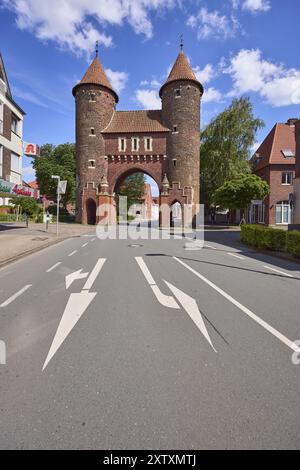 Historic city gate Luedinghauser Tor against blue sky with cumulus clouds and Luedinghauser Strasse in Duelmen, Muensterland, Coesfeld district, North Stock Photo