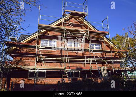 Europe, Germany, Lower Saxony, new build, residential building, apartment block, clinker brick building, pitched roof, scaffolding, Europe Stock Photo