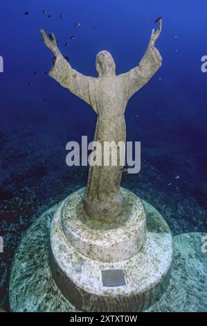 Statue of Jesus Christ on a pedestal under water, stretching out his arms, looking pleadingly upwards to heaven, Mediterranean Sea, Bay of San Fruttuo Stock Photo