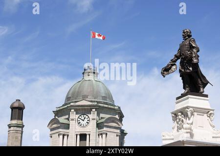 The old post office with its clock tower and monument to Samuel de Champlain, founder of Quebec City by Paul Chevre in 1898 Stock Photo