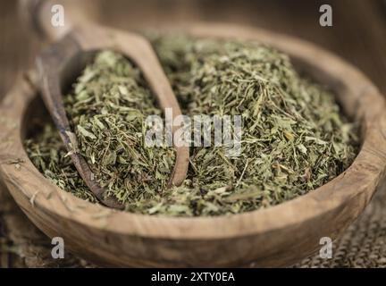 Old wooden table with dried Stevia leaves (close-up shot, selective focus) Stock Photo