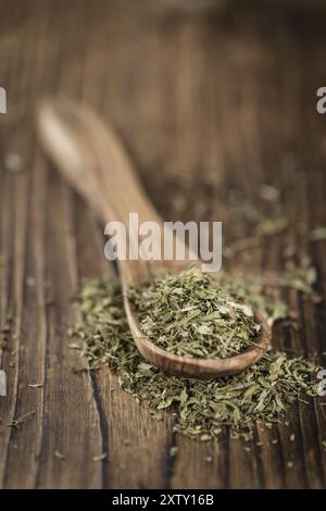 Old wooden table with dried Stevia leaves (close-up shot, selective focus) Stock Photo