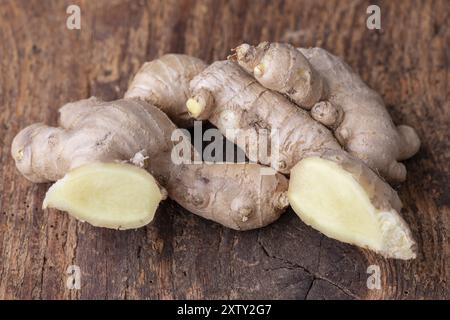 Fresh ginger on dark wood Stock Photo