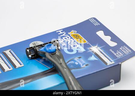 Kyiv, Ukraine - March 29, 2024: Studio shoot of Bic Hybrid Flex shaving razors machine with replaceable cassette blades closeup on white. Bic produces Stock Photo