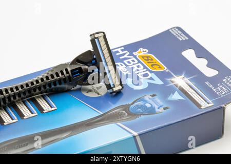 Kyiv, Ukraine - March 29, 2024: Studio shoot of Bic Hybrid Flex shaving razors machine with replaceable cassette blades closeup on white. Bic produces Stock Photo