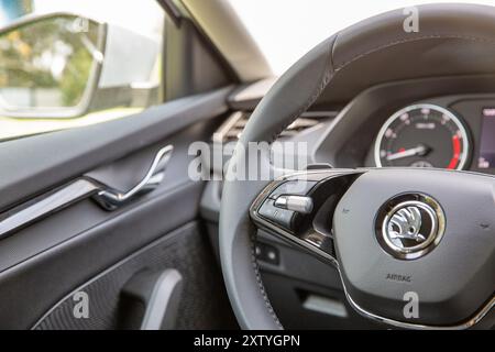 Kyiv, Ukraine - April 14, 2024: Czech new model Skoda Octavia A8 modern car interior dashboard and steering wheel closeup. Technologies, combining lux Stock Photo